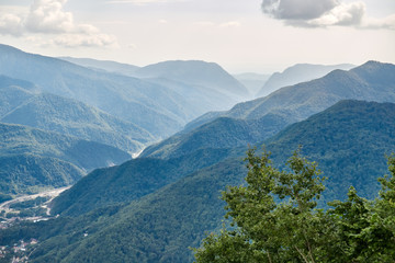 The gorge among the mountains with green slopes.
