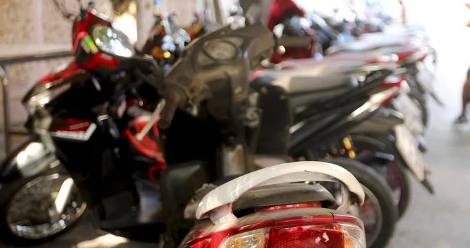 Busy motorcycle parking. Motorbikes standing on street