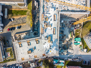 Aerial view of construction site in Switzerland with large yellow crane