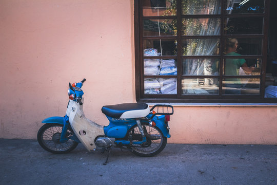 Old Honda motorcycle on the street.