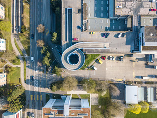 Aerial view of rooftop parking with spiral ramp for car