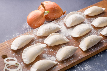 frozen dumplings on a cutting board