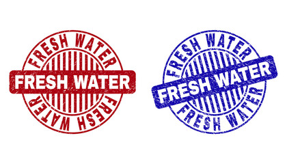 Grunge FRESH WATER round stamp seals isolated on a white background. Round seals with grunge texture in red and blue colors.