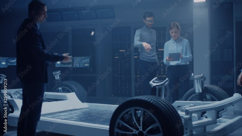 Poster Automobile Engineer Working on Electric Car Chassis Platform, Using Tablet Computer Augmented Reality with 3D CAD Software Modelling. Innovative Facility: Vehicle Frame with Wheels, Engine, Battery