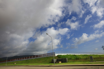 Raining cloud over New factory , Fence of new factory in green area