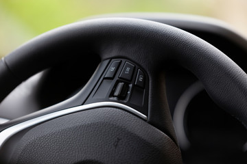The steering wheel of a good modern car