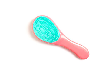 Pink and black hair brush on white background - hairdresser salon and trichology concept