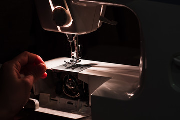 Sewing machine and hand