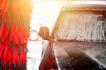 Automatic car wash in action. Car wash concept. Automated technology