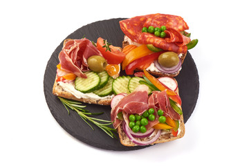 Snacks of different types of sandwiches, close-up, isolated on white background