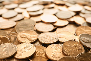 Pile of shiny USA one cent coins as background