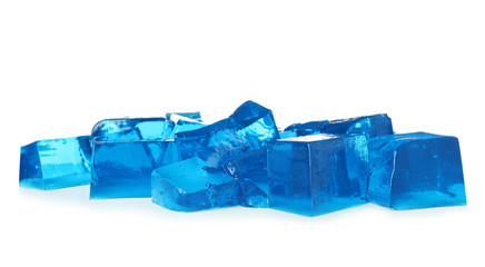 Heap of blue jelly cubes on white background