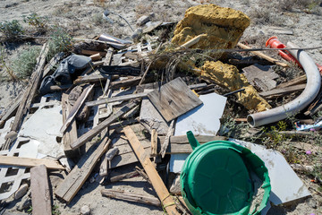 Pile of garbage, junk and litter dumped in the desert. Taken in the Salton Sea area of California in Imperial County