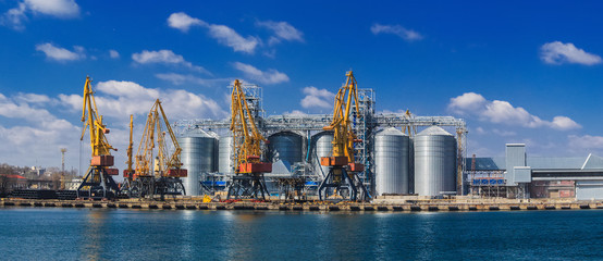 Lifting cargo cranes, ships and grain dryer in Sea Port of Odessa, Black Sea, Ukraine