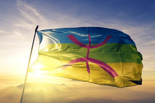 Berbers flag waving on the top sunrise mist fog