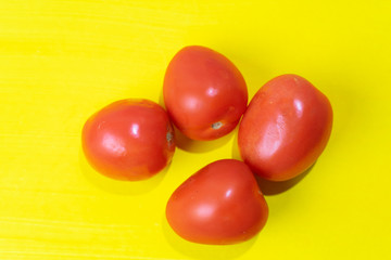 Tomatoes on colorful background