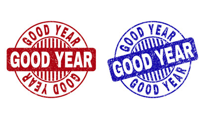 Grunge GOOD YEAR round stamp seals isolated on a white background. Round seals with grunge texture in red and blue colors. Vector rubber overlay of GOOD YEAR tag inside circle form with stripes.