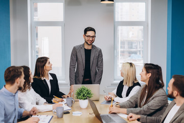 Business colleagues in conference meeting room during presentation