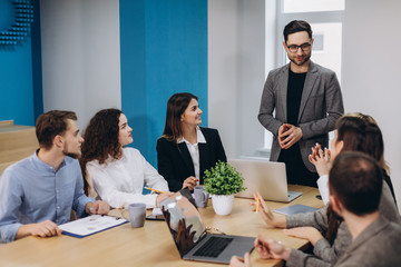 Business colleagues in conference meeting room during presentation