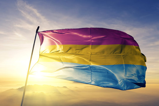 Pansexual Pride Flag Waving On The Top Sunrise Mist Fog