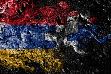 Artsakh smoky mystical flag on the old dirty wall background