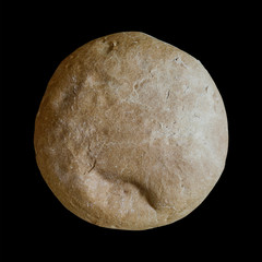 loaf of white bread on a black square background