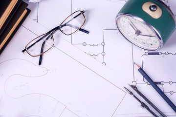 Several drawings and tools for drawing on the table in the engineer