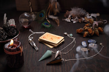 Faerie accessories. A deck of old divination cards and a stone pendulum.