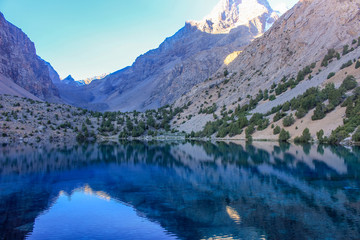 Fototapeta na wymiar The blue lake of the fan mountains of Tajikistan