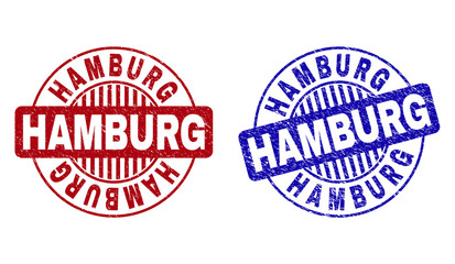 Grunge HAMBURG round stamp seals isolated on a white background. Round seals with grunge texture in red and blue colors. Vector rubber imitation of HAMBURG text inside circle form with stripes.