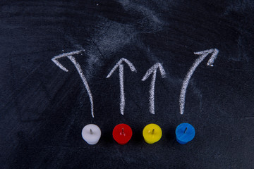 Fototapeta na wymiar different pins on blackboard with arrows