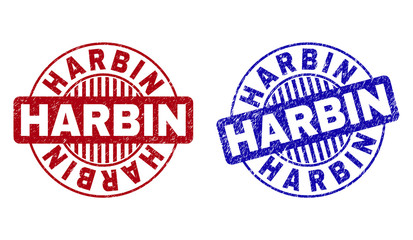 Grunge HARBIN round stamp seals isolated on a white background. Round seals with grunge texture in red and blue colors. Vector rubber imitation of HARBIN label inside circle form with stripes.