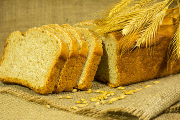 fresh bread, wheat ears and grains