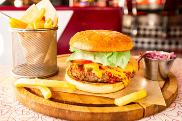 Huge Cheeseburger With Large Meat Patty, Green Lettuce, Red Tomato, Cucumber, Plenty Of Tasty...