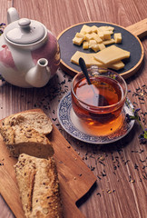 cup of tea with bread and cheese