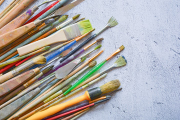 Fototapeta premium brushes and painter's hands on a plane
