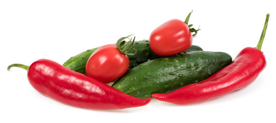 .tomatoes cucumbers and peppers on a white background