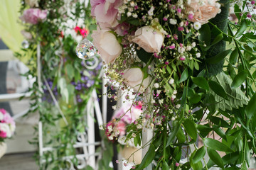Fototapeta na wymiar Photo of pink and white flowers, green leaves. Wedding decoration. Crystal.