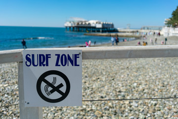 A no smoking sign by the sea