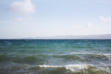 Adriatic Sea landscape with mountains island and sea waves.