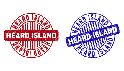 Grunge HEARD ISLAND round stamp seals isolated on a white background. Round seals with grunge texture in red and blue colors.