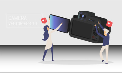 Cartoon pictures with Realistic professional camera with button and display in isometric style, people man and woman. Vector illustration.