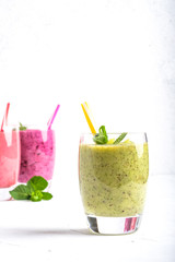 Fruit and berry smoothie blend at home on a light background copy space.