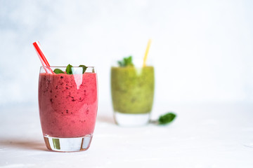 Fruit and berry smoothie blend at home on a light background copy space.