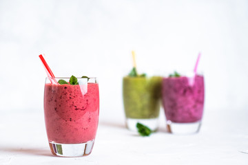 Fruit and berry smoothie blend at home on a light background copy space.