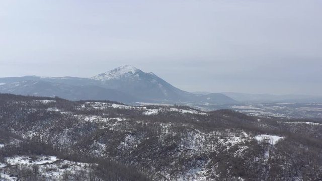 Snow over the top of  mountain Rtanj 4K aerial video