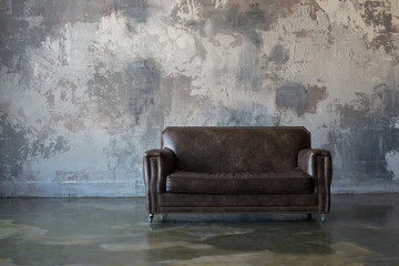 brown sofa on the wall background, loft style
