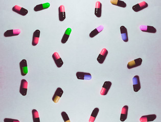 colorful pills on white background