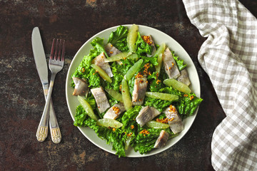 Salad with herring fillet, lemon and lettuce. Healthy food. Keto diet. Keto Salad