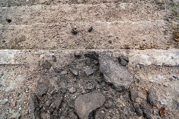 Broken ladder with sand